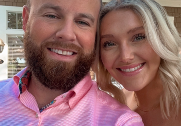 A man and woman smiling for a photo.