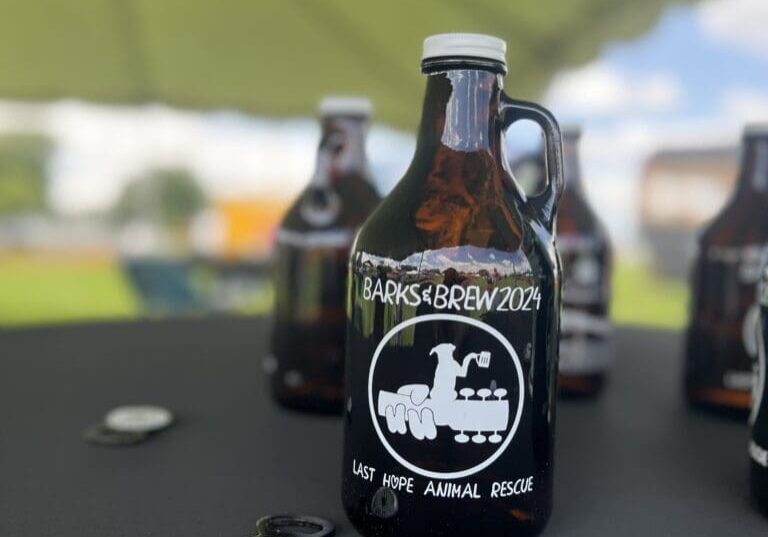 Barks & Brew 2024 beer bottle with logo.