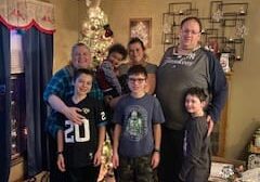 Family poses for a Christmas photo.